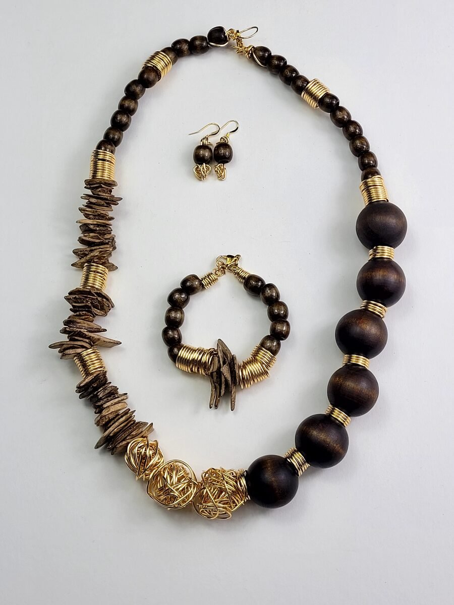 Wood beaded necklace with decorative gold knot accents.