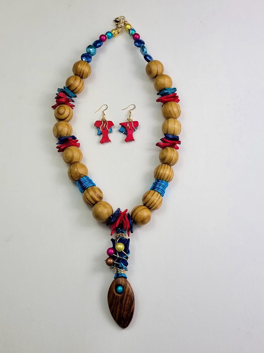 Natural wood beaded necklace with red and teal accents.