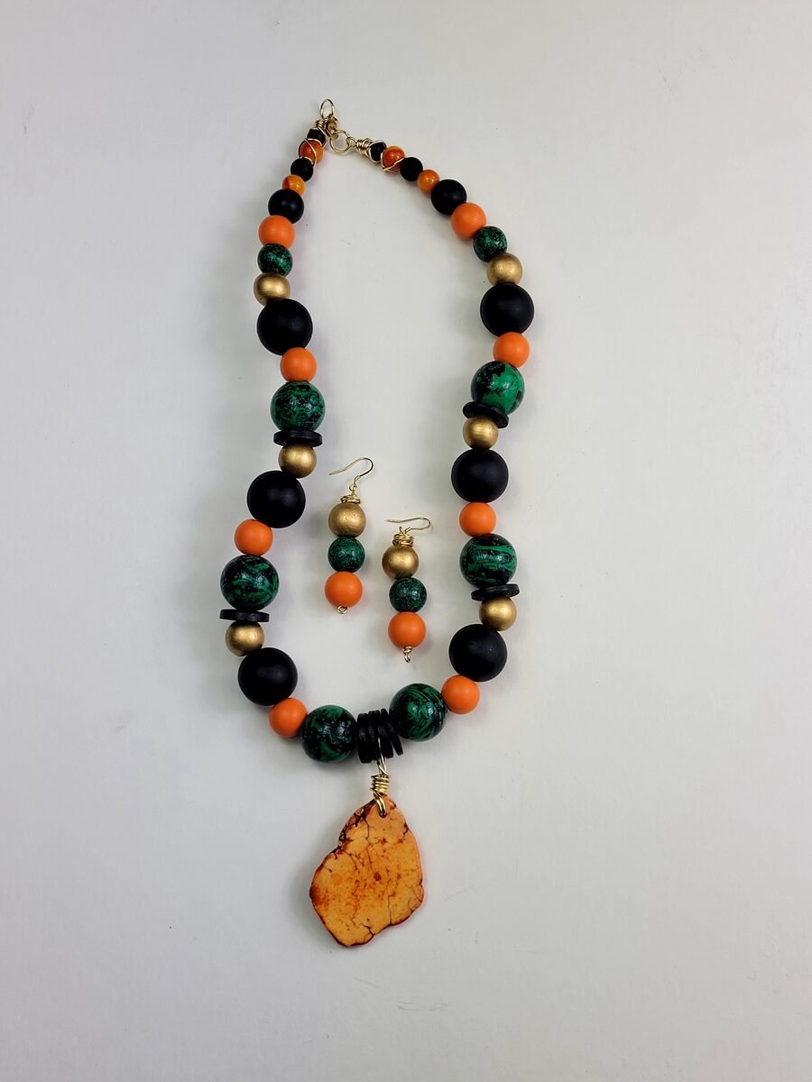 Orange, black, and green beaded necklace set.
