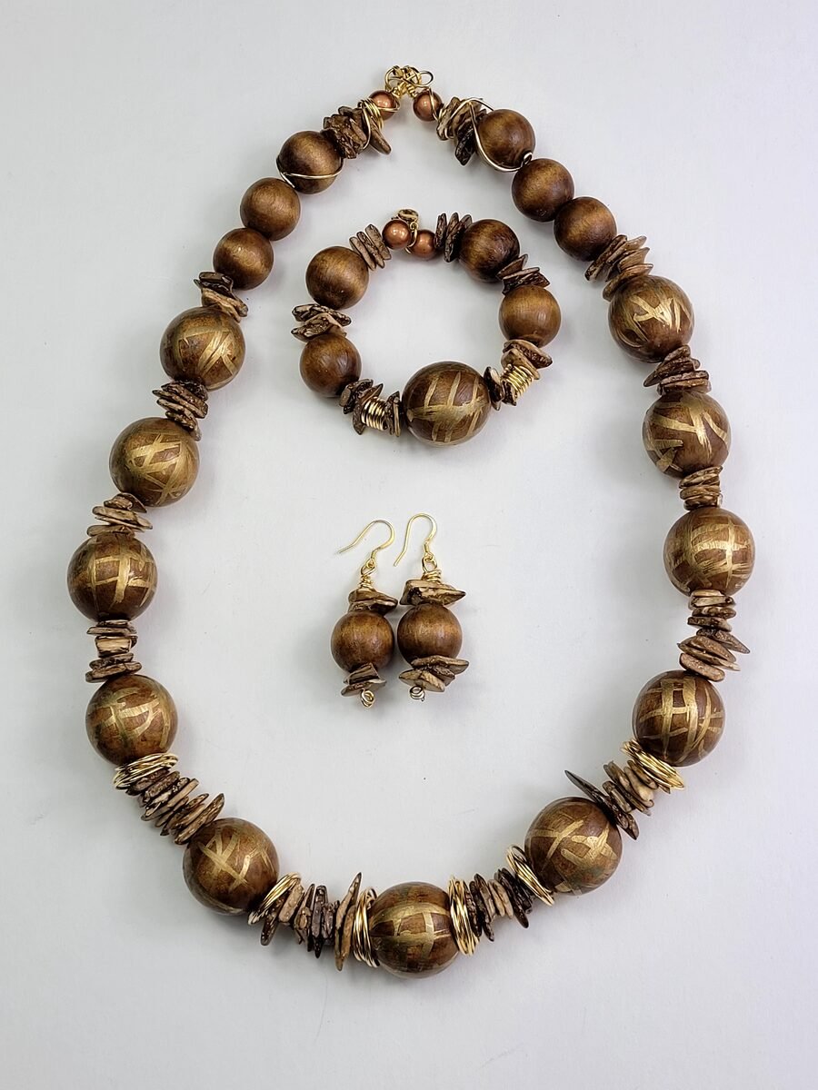 Burnt-etched wood beaded necklace set.