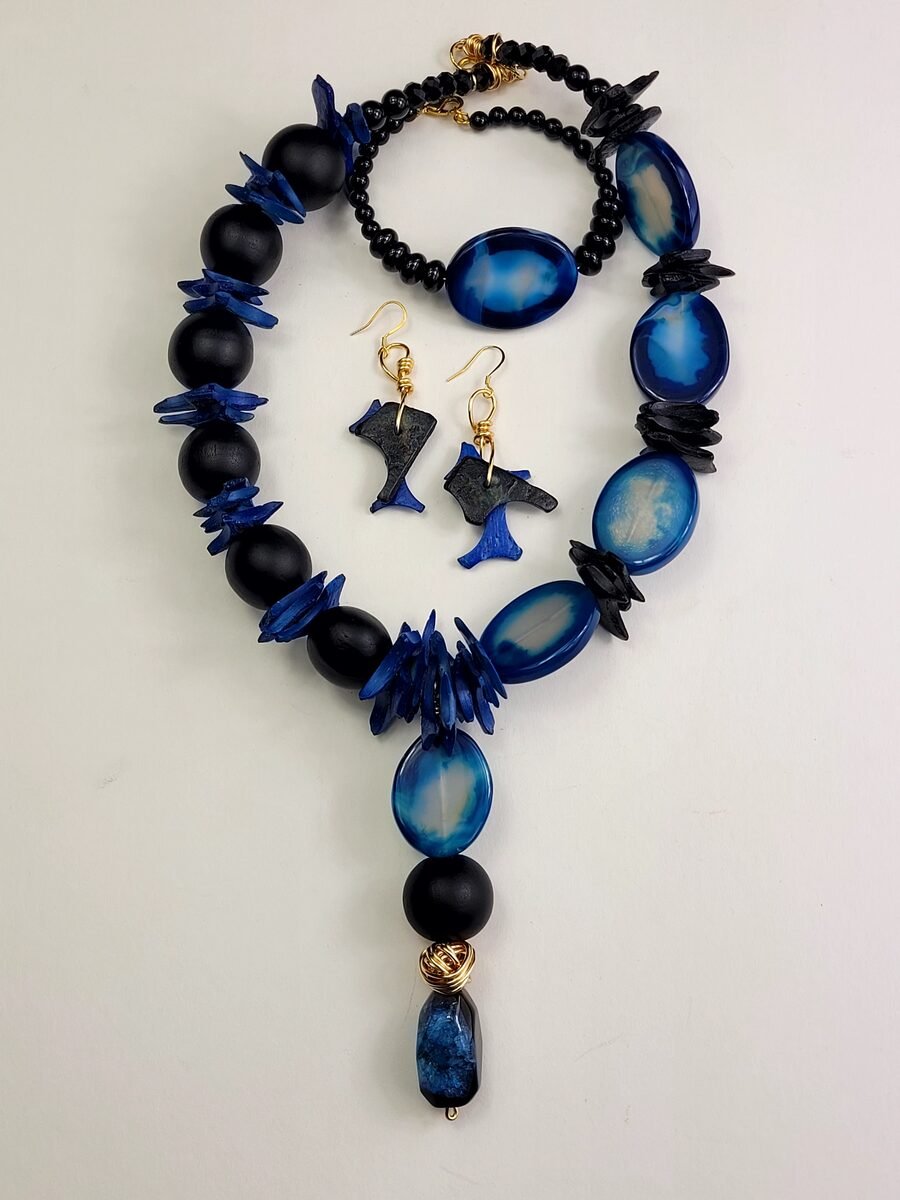 Blue and black beaded set with fish-motif earrings.