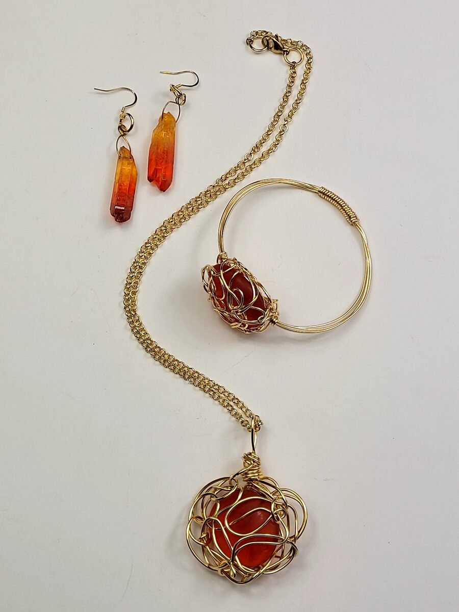 Red amber beaded necklace with wire-wrap accents.