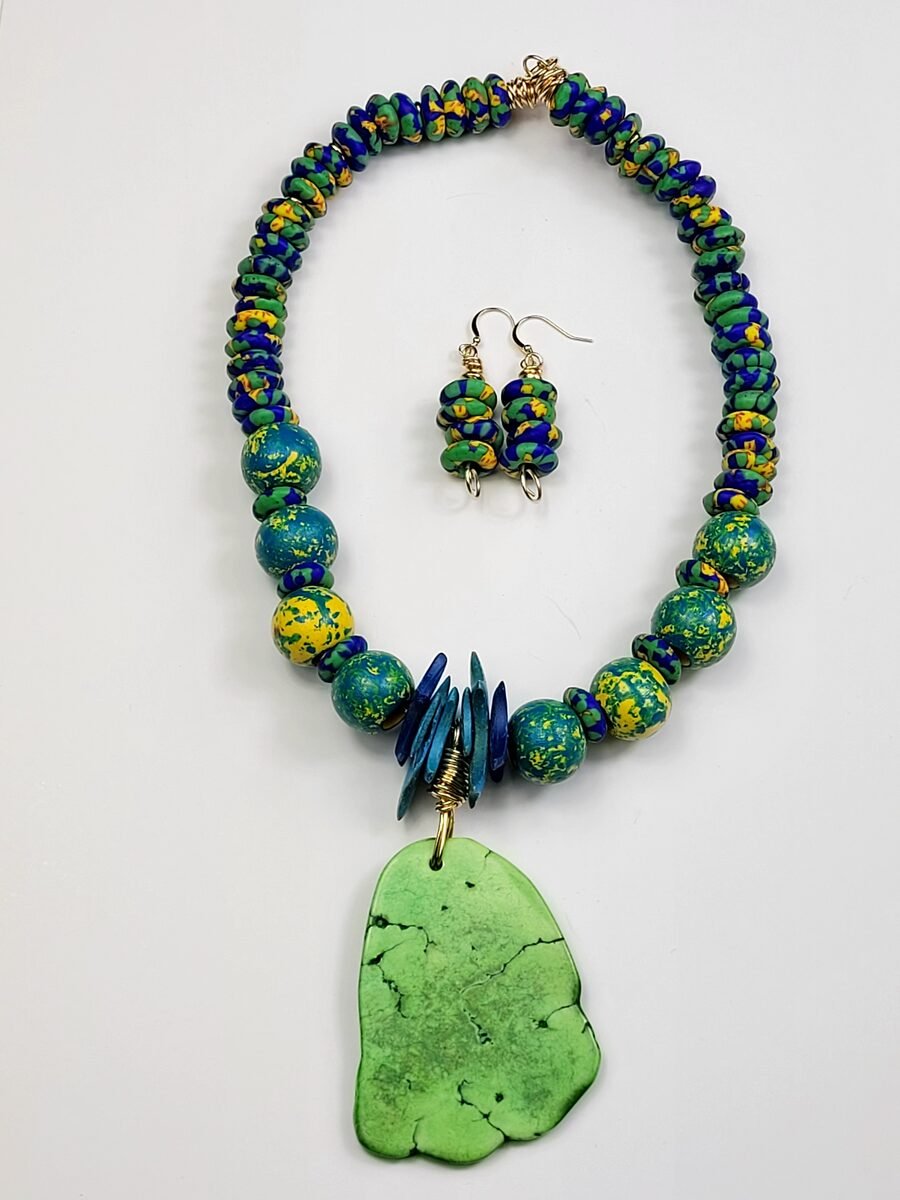Blue, yellow, and green beaded necklace with slab pendant.