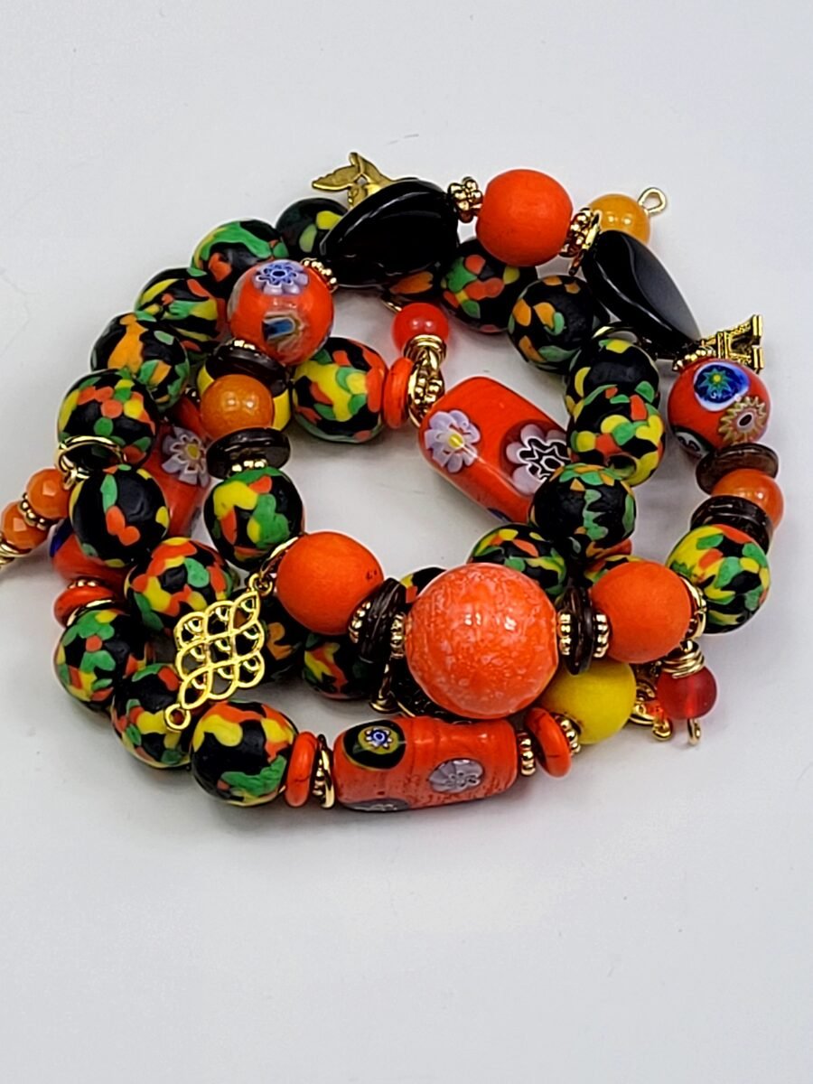 Orange and green confetti-pattern beaded bracelet.