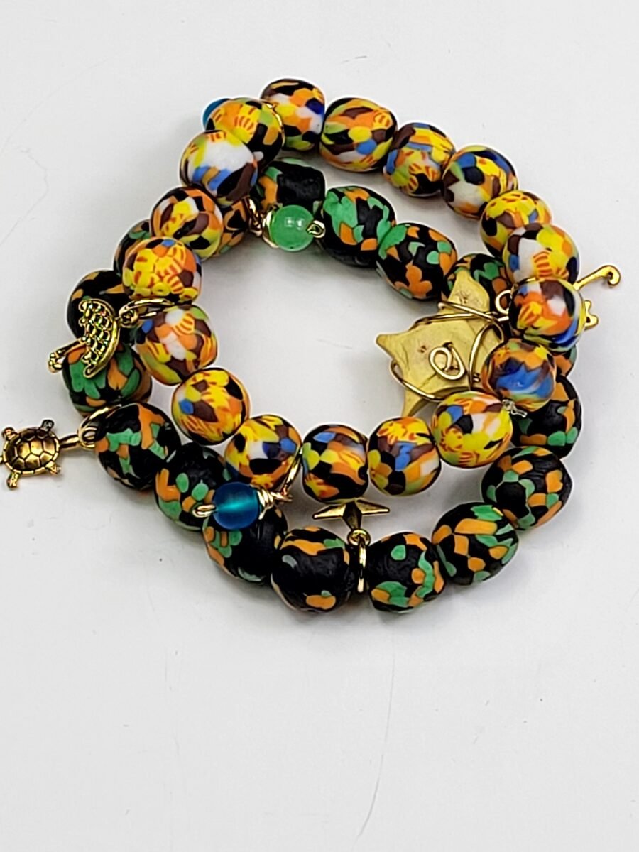 Yellow and green beaded bracelet with a turtle charm.